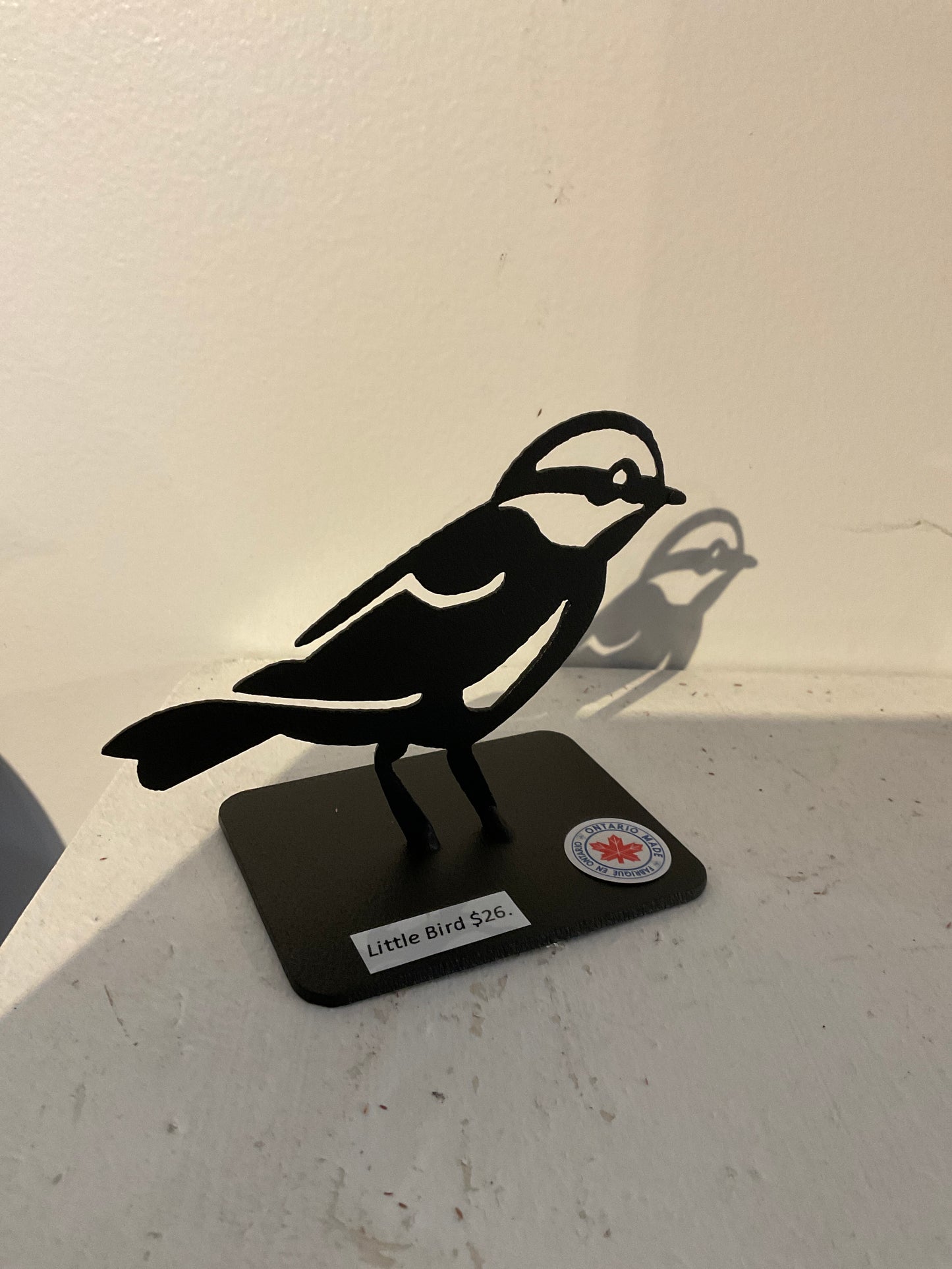 Small metal bird