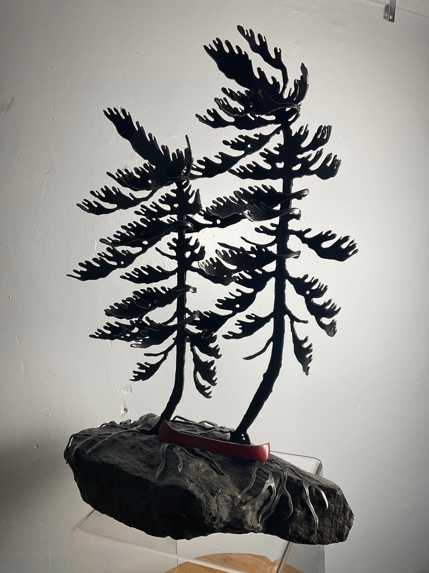 Cathy Mark windswept pines with canoe on granite