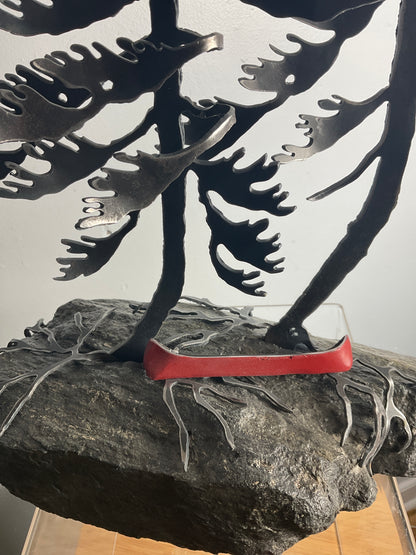 Cathy Mark windswept pines with canoe on granite