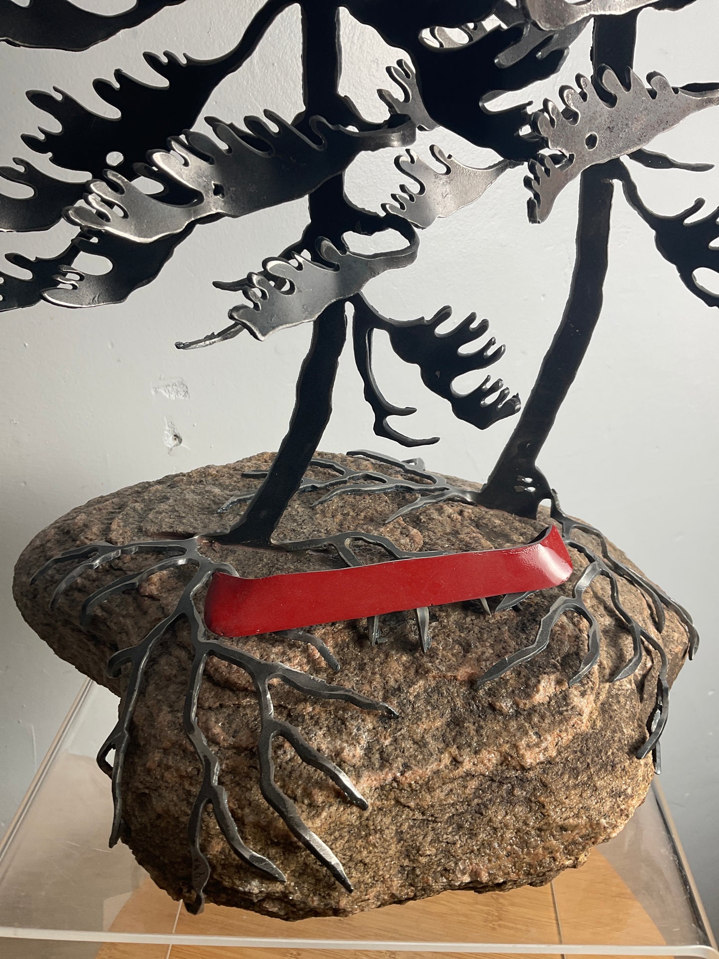 Cathy Mark windswept pines with canoe on granite